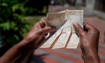 venezolanos viven con US$100 - acn