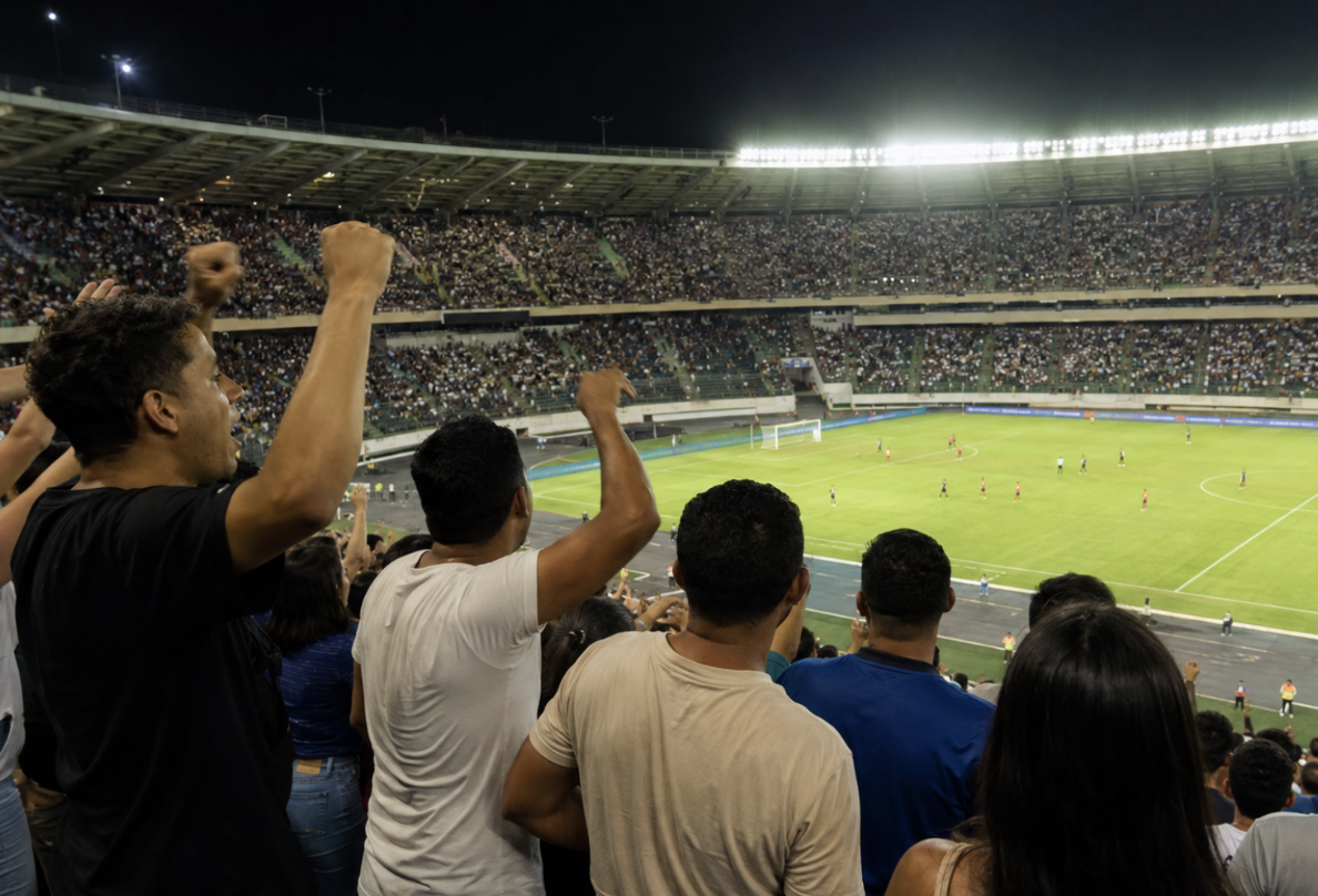 Afición celebra un partido de fútbol en un estadio lleno.